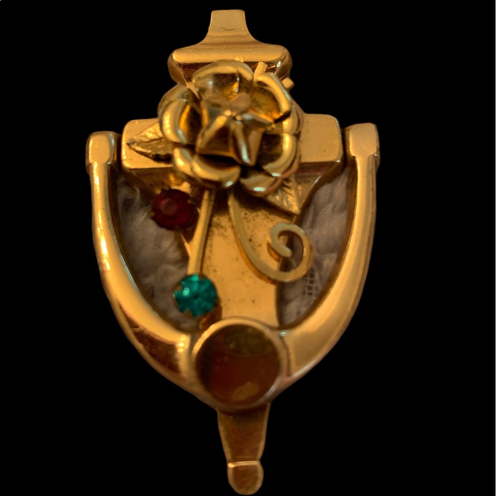 Vintage brooch door knocker moves